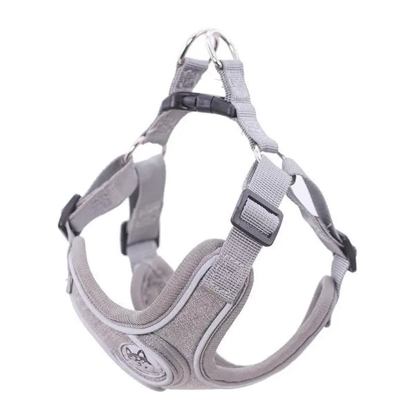 Grey adjustable dog harness with soft padding, sturdy buckles, and Pawlenza logo